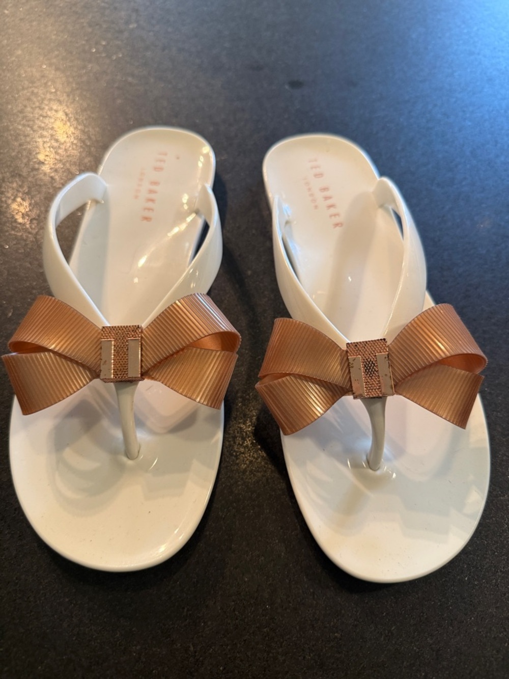 Ted Baker White Jelly Flip Flops with Bronze Bow Accents